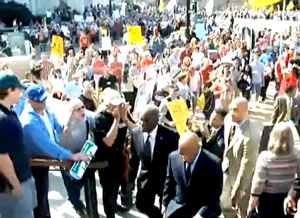 In fact, nobody spat on Cleaver. He wandered too close to a screaming protester and was hit by flying saliva. The “N” word cannot be heard in either of the videos below, although it is difficult to tell what beyond “kill the bill” is being yelled at the Congress critters as they flaunted their power over the plebs.